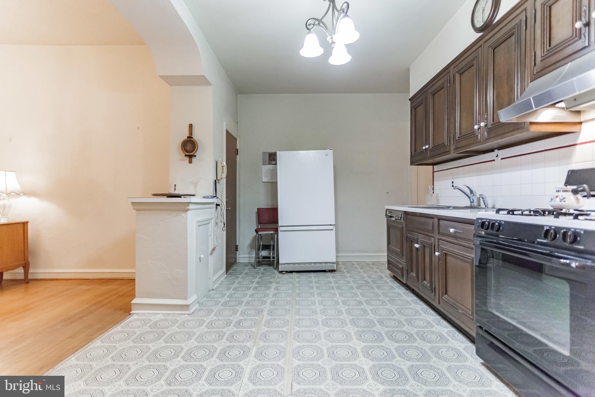513 Pine Street Philadelphia, PA 19106 - Photo 7 of 32 a kitchen with stainless steel appliances granite countertop a stove a sink and a refrigerator