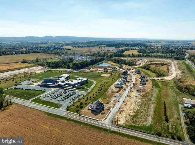 an aerial view of a house with a garden
