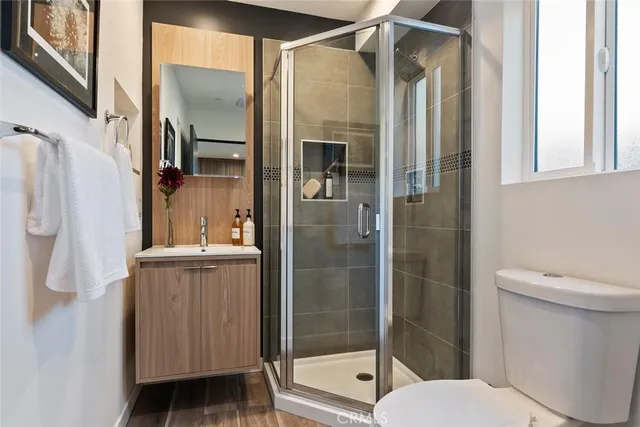 a bathroom with a shower and a toilet