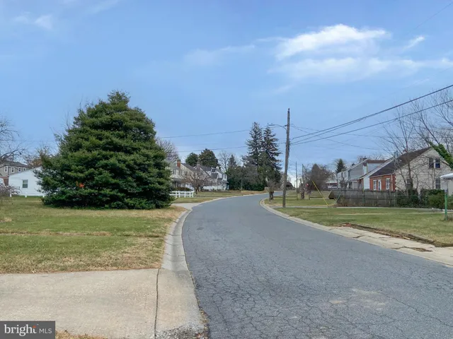 a view of a road with a building in the background