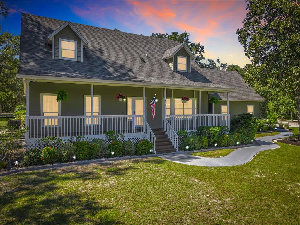 a view of a brick house next to a yard