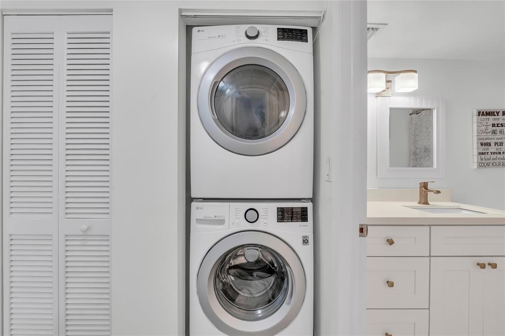 3920 Inverrary Boulevard, Unit 104C Lauderhill, FL 33319 - Photo 13 of 15 a utility room with sink dryer and washer