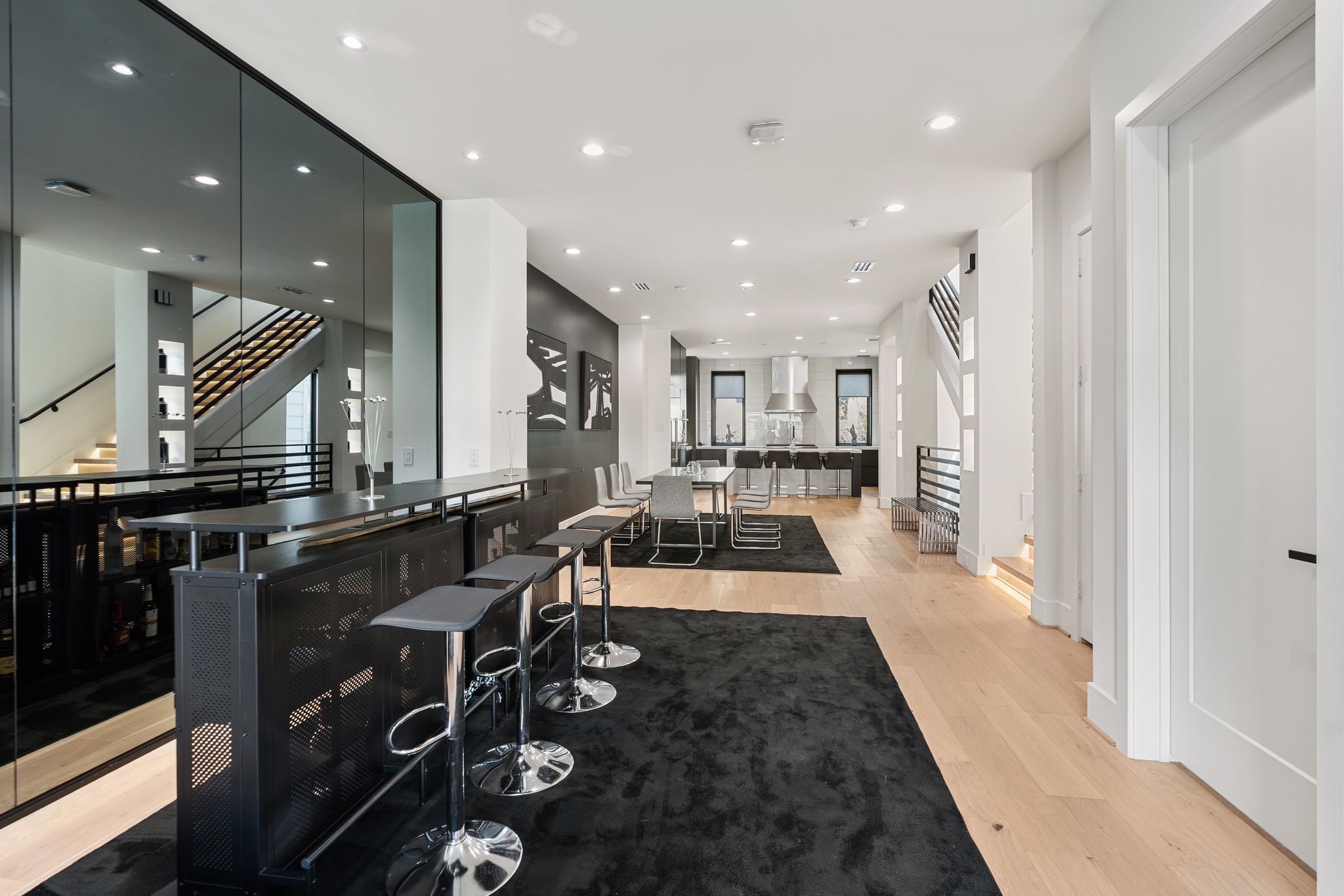 1918 Brun Street Houston, TX 77019 - Photo 22 of 43 The mirrored accent wall enhances the sense of openness while creating an upscale atmosphere.