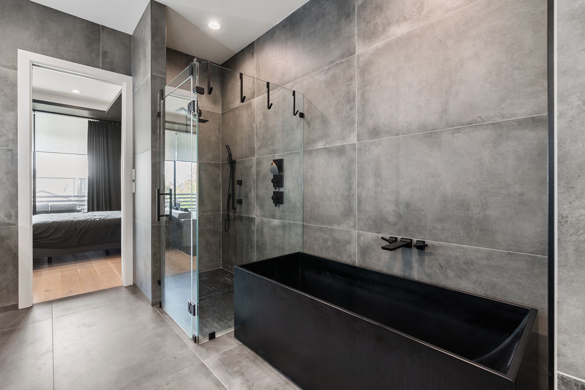 1918 Brun Street Houston, TX 77019 - Photo 36 of 43 This spa like feature offers a peaceful setting for relaxation while showcasing sleek matte black fixtures and a clean, contemporary design that elevates the entire primary bath experience.