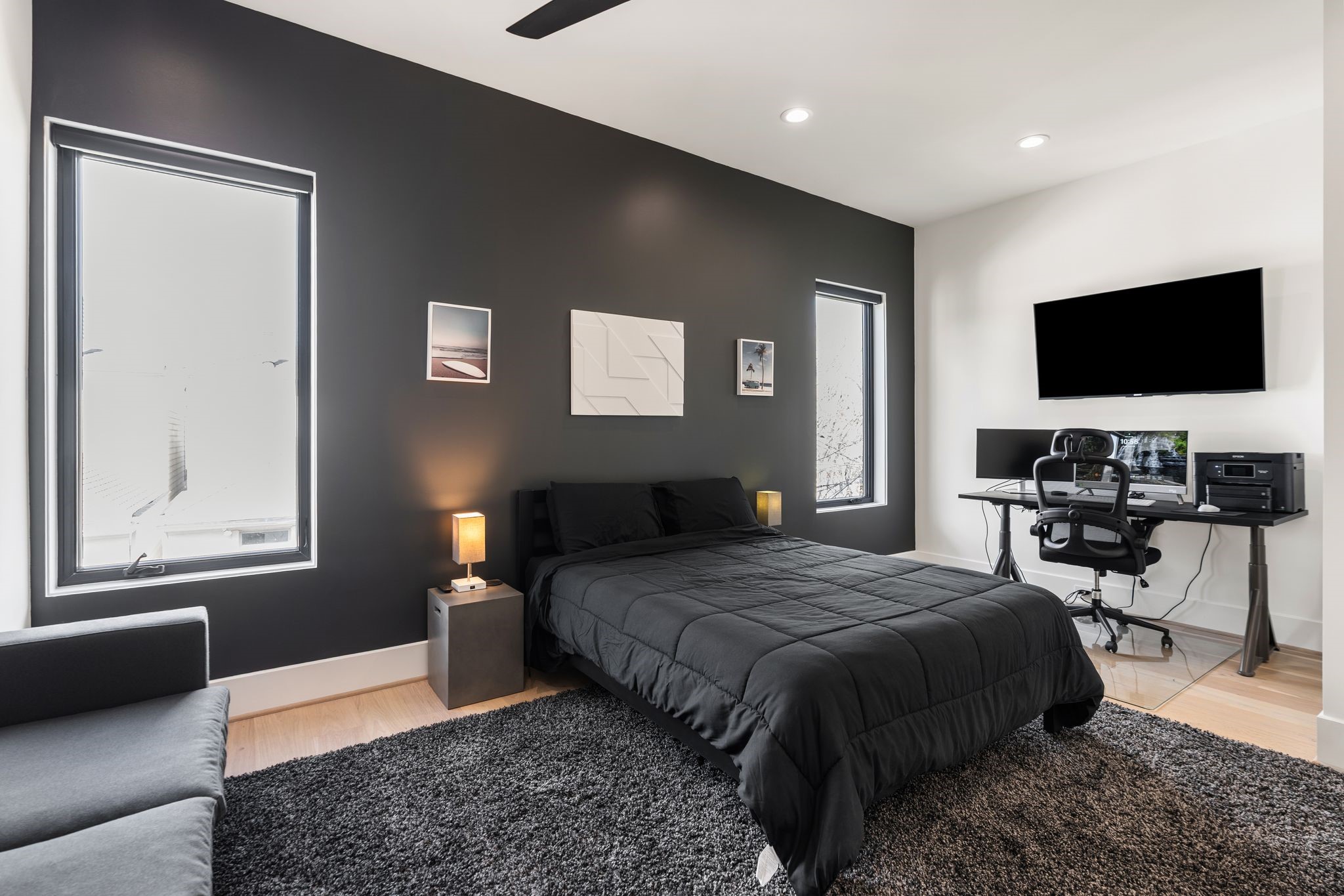 1918 Brun Street Houston, TX 77019 - Photo 40 of 43 Ideal as a guest suite, home office, or flex space, this secondary room features wood flooring, a modern accent wall, recessed lighting, and generous windows that provide natural light.