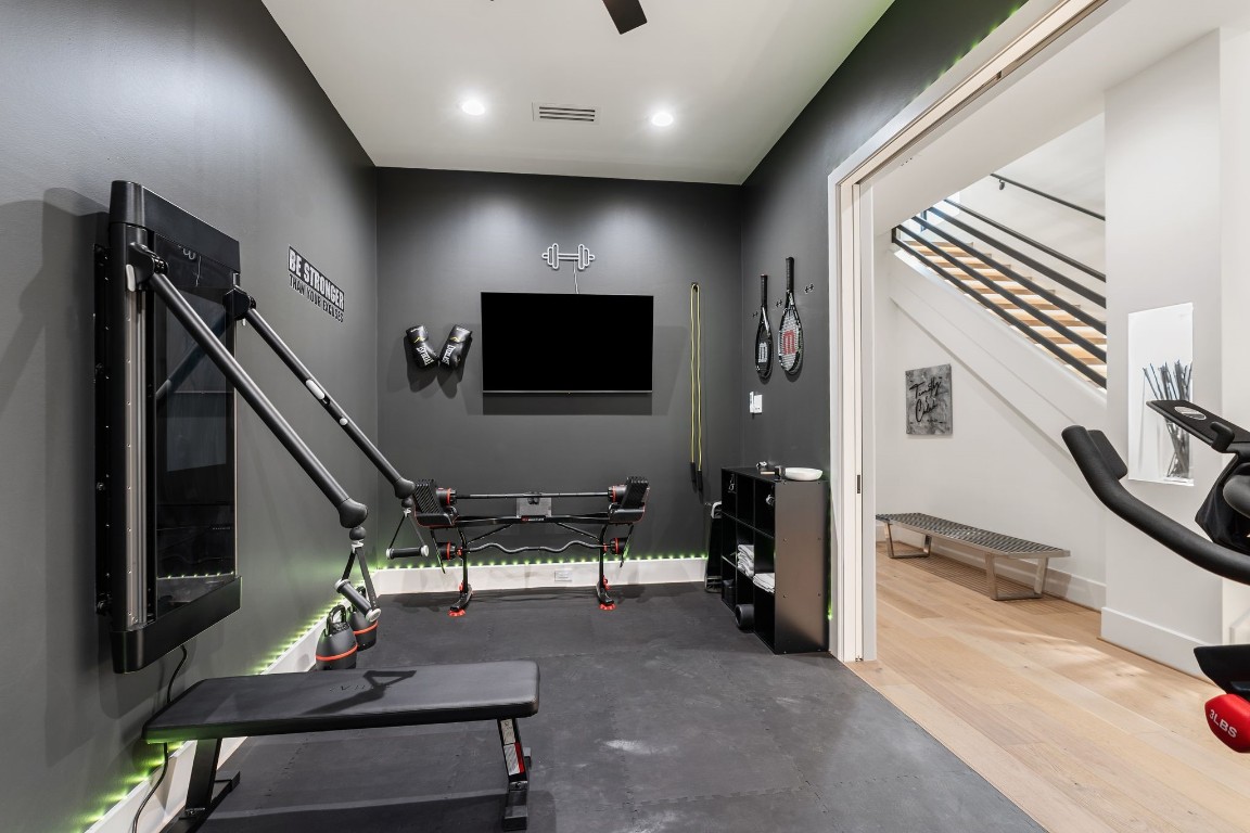 1918 Brun Street Houston, TX 77019 - Photo 4 of 43 This versatile home office is currently utilized as a private workout room, offering flexibility to suit a variety of lifestyle needs.