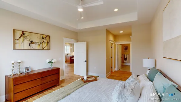 a bathroom with a double vanity sink toilet and a mirror