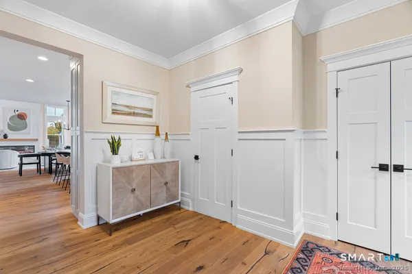 a view of kitchen with furniture and wooden floor