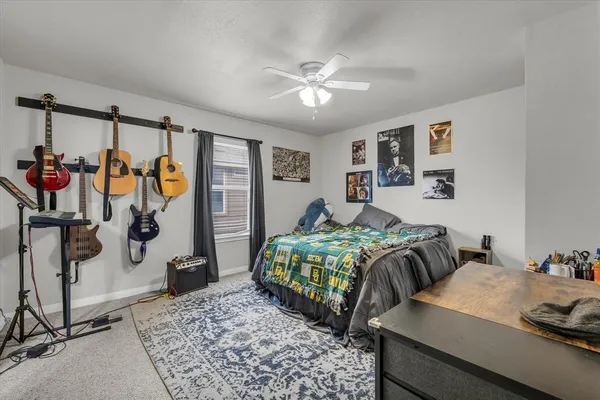 a bedroom with a bed and a mirror