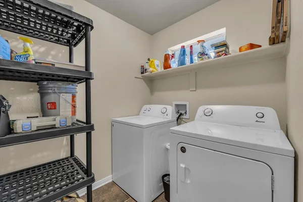 a utility room with dryer and washer