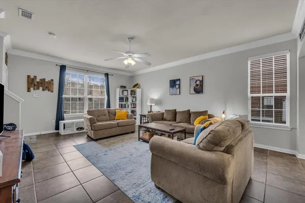 a living room with furniture and a window