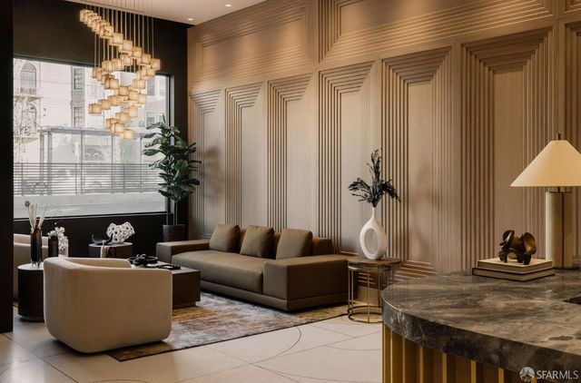 a view of a hallway with paintings on the wall