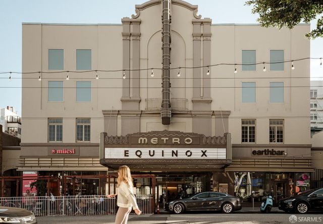 a view of a large building next to a road