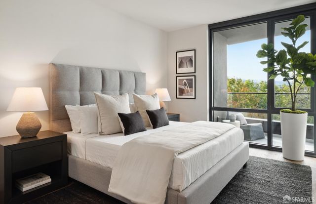 a bedroom with bed and a window