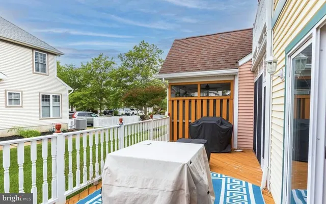 a view of a chair and tables in the balcony