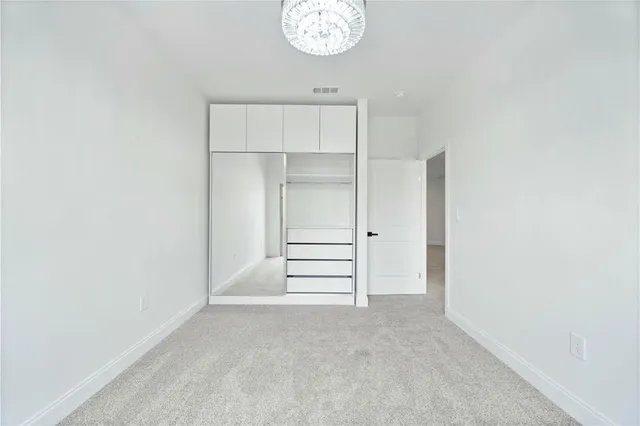 a bathroom with a bathtub shower sink vanity and mirror