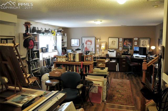 7860 Swiftrun Road Colorado Springs, CO 80920 - Photo 6 of 8 The art studio downstairs would make a great lower level family room!