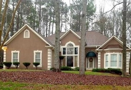 26 Springfield Court Newnan, GA 30265 - Photo 1 of 1 a front view of a house with garden