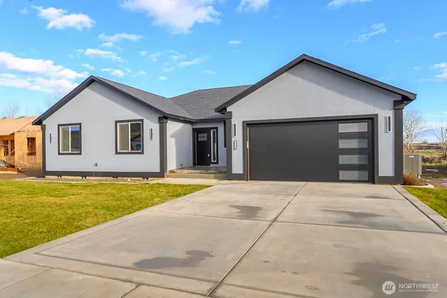 a front view of a house with yard