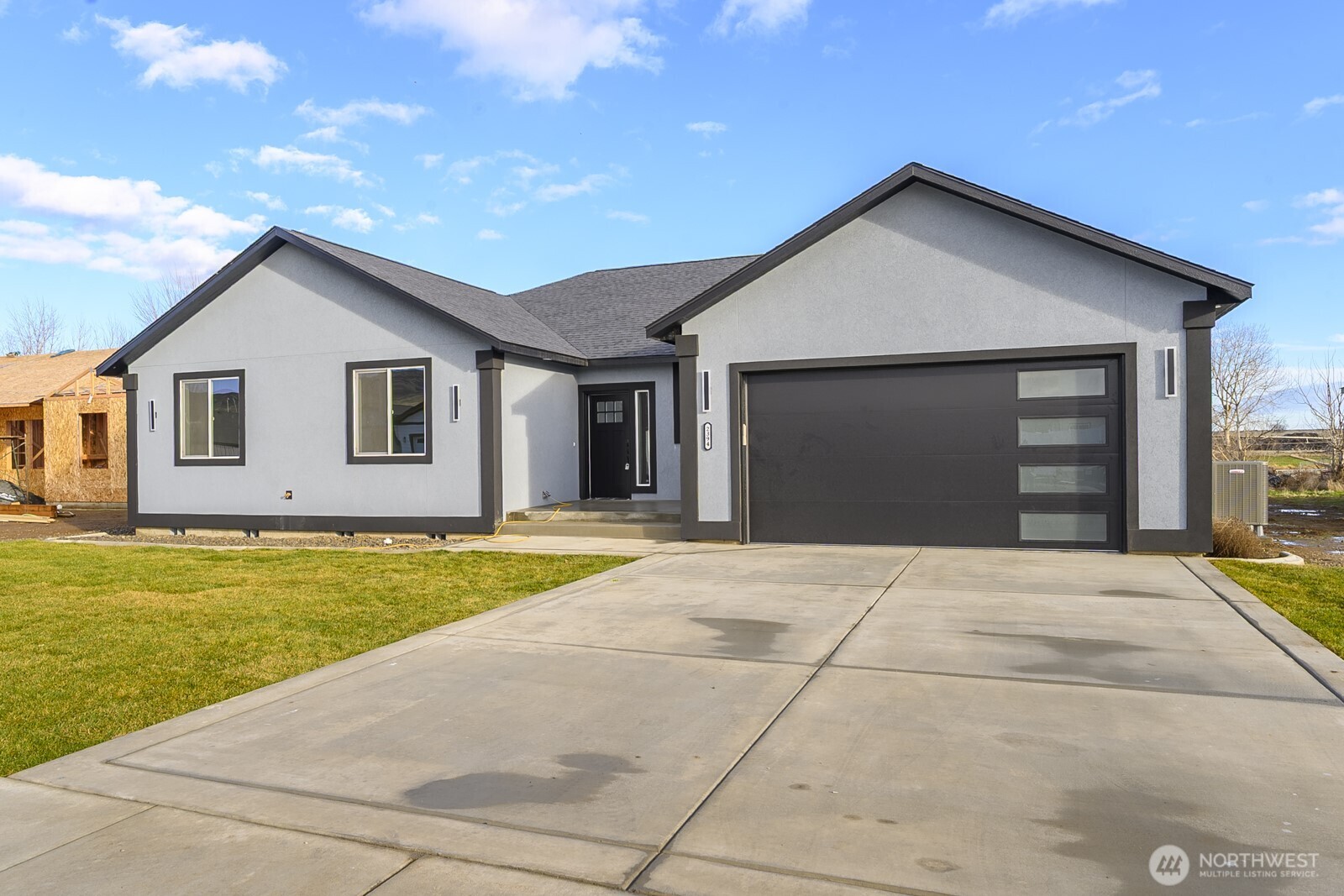 a front view of a house with yard