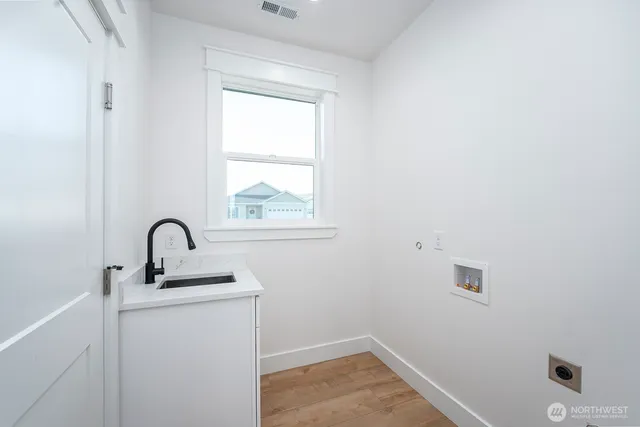 a room with a sink and window