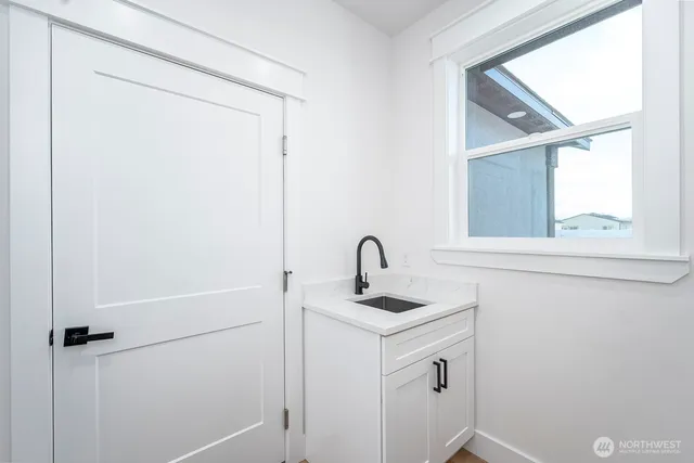 a bathroom with a sink and mirror