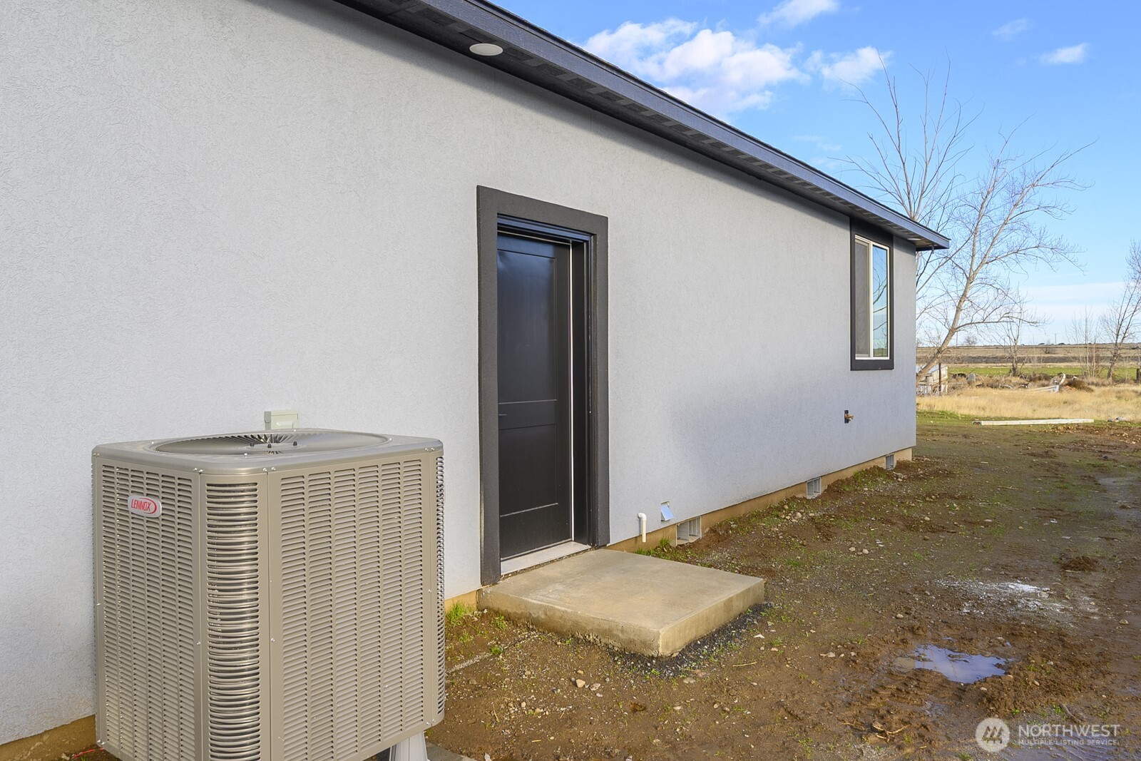 2394 Hunters Street Ephrata, WA 98823 - Photo 28 of 29 a bedroom with a bed and dresser with wooden floor