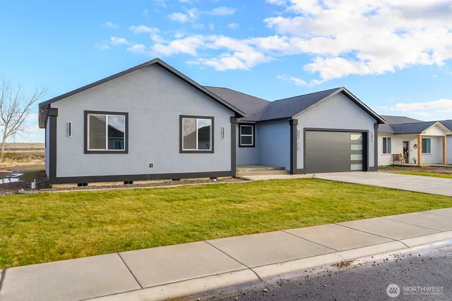a house with swimming pool in front of it