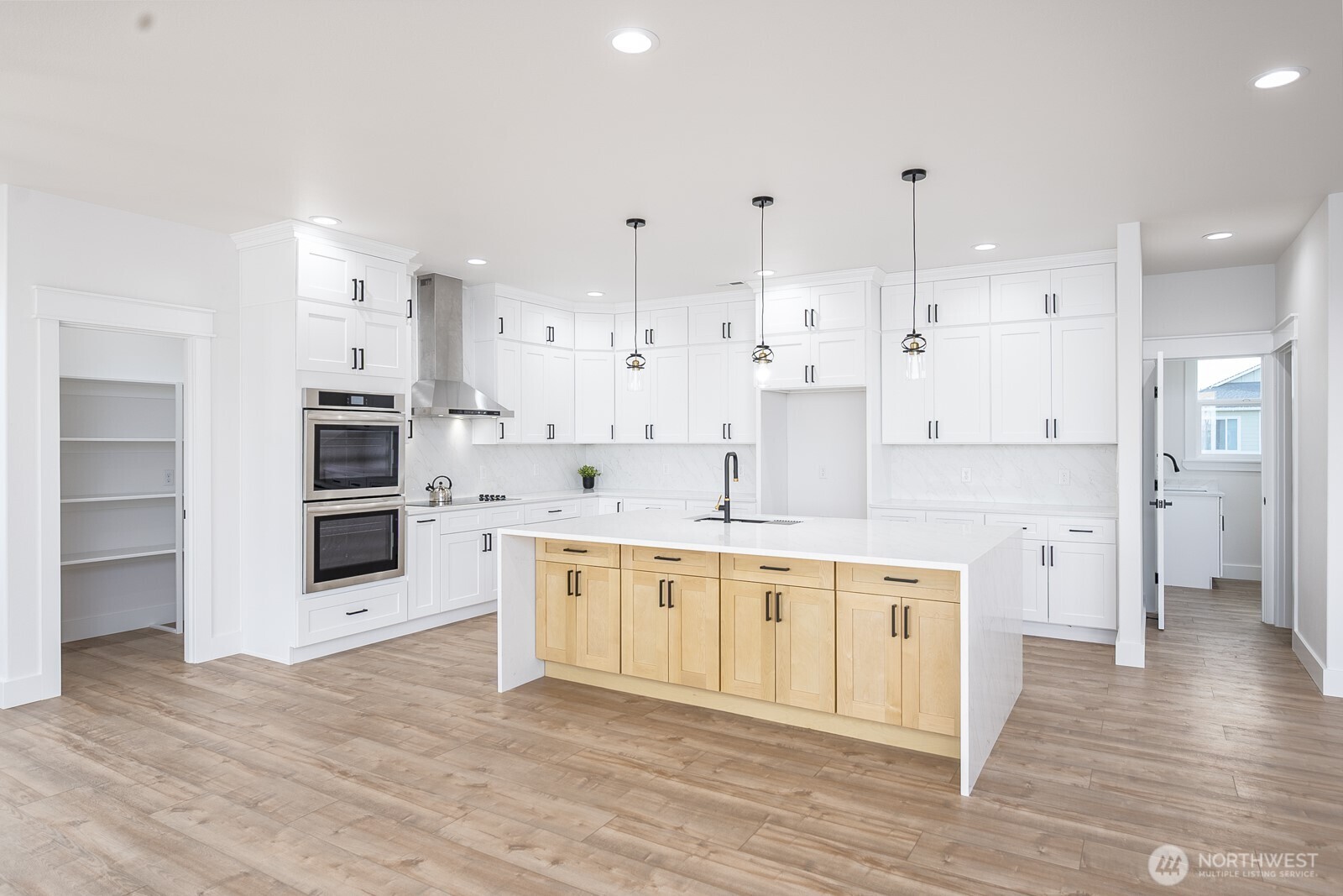 2394 Hunters Street Ephrata, WA 98823 - Photo 5 of 29 a large kitchen with stainless steel appliances kitchen island granite countertop a large counter top and a stove top oven