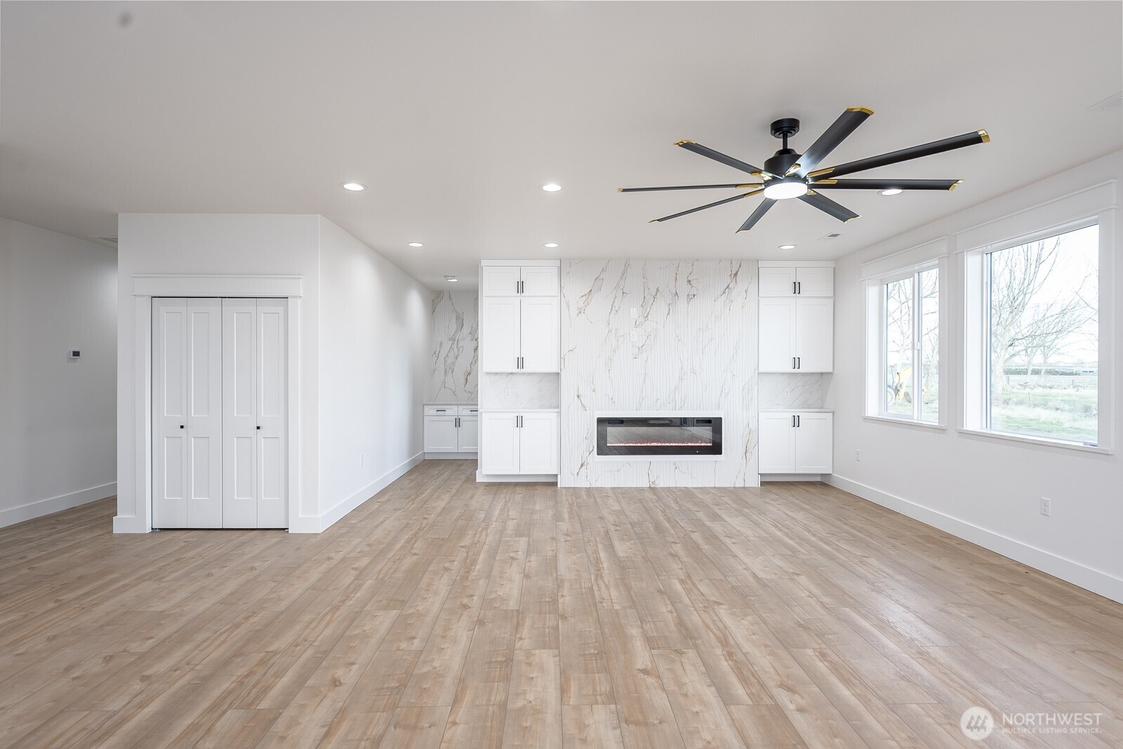 2394 Hunters Street Ephrata, WA 98823 - Photo 9 of 29 a view of a livingroom with a ceiling fan window and wooden floor