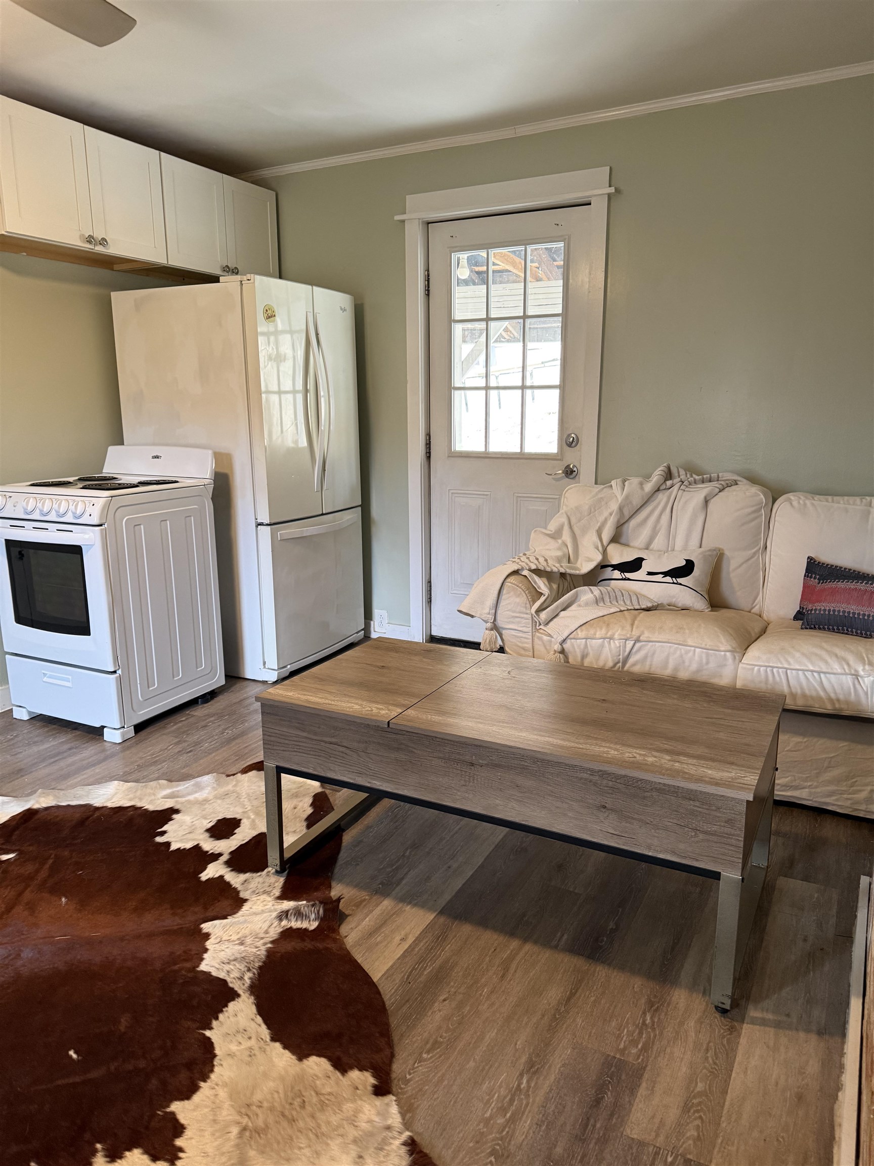635-633 Stuart Street Staunton, VA 24401 - Photo 12 of 41 a room with a bed and a refrigerator