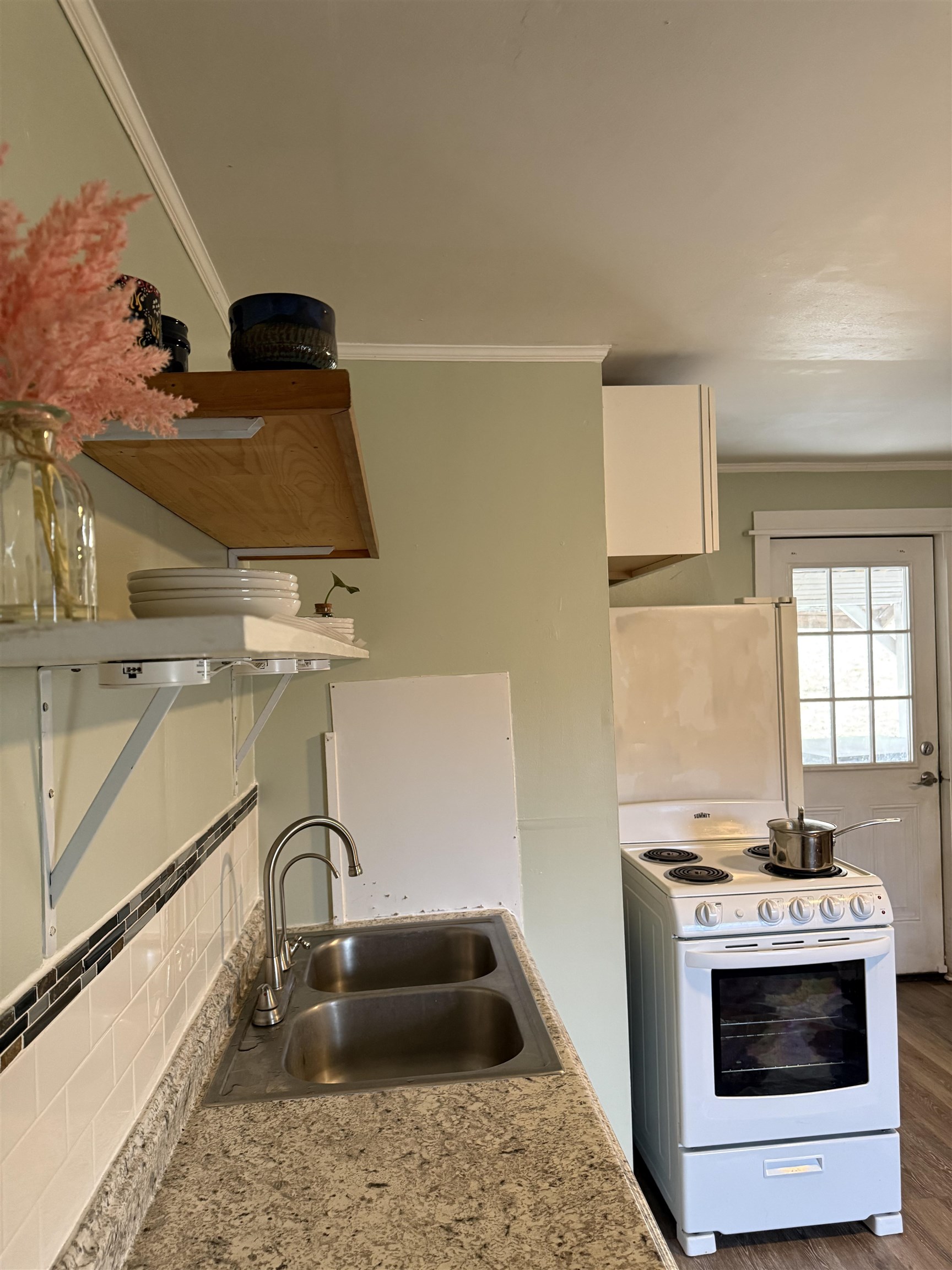 635-633 Stuart Street Staunton, VA 24401 - Photo 18 of 41 a kitchen with a sink and a stove top oven
