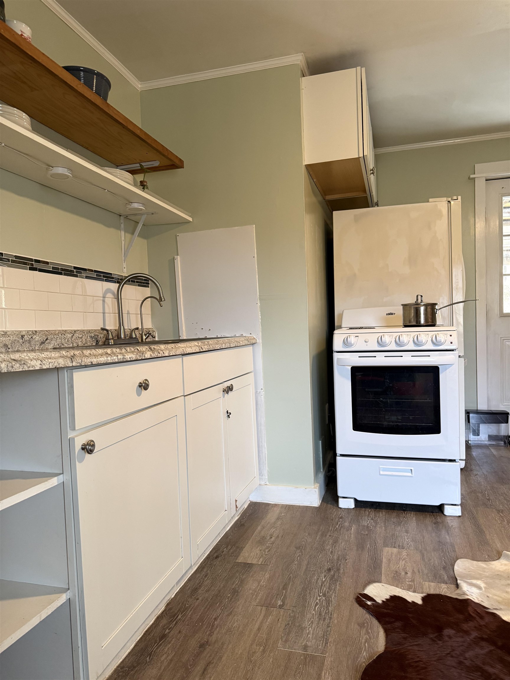 635-633 Stuart Street Staunton, VA 24401 - Photo 19 of 41 a kitchen with a sink and a stove top oven