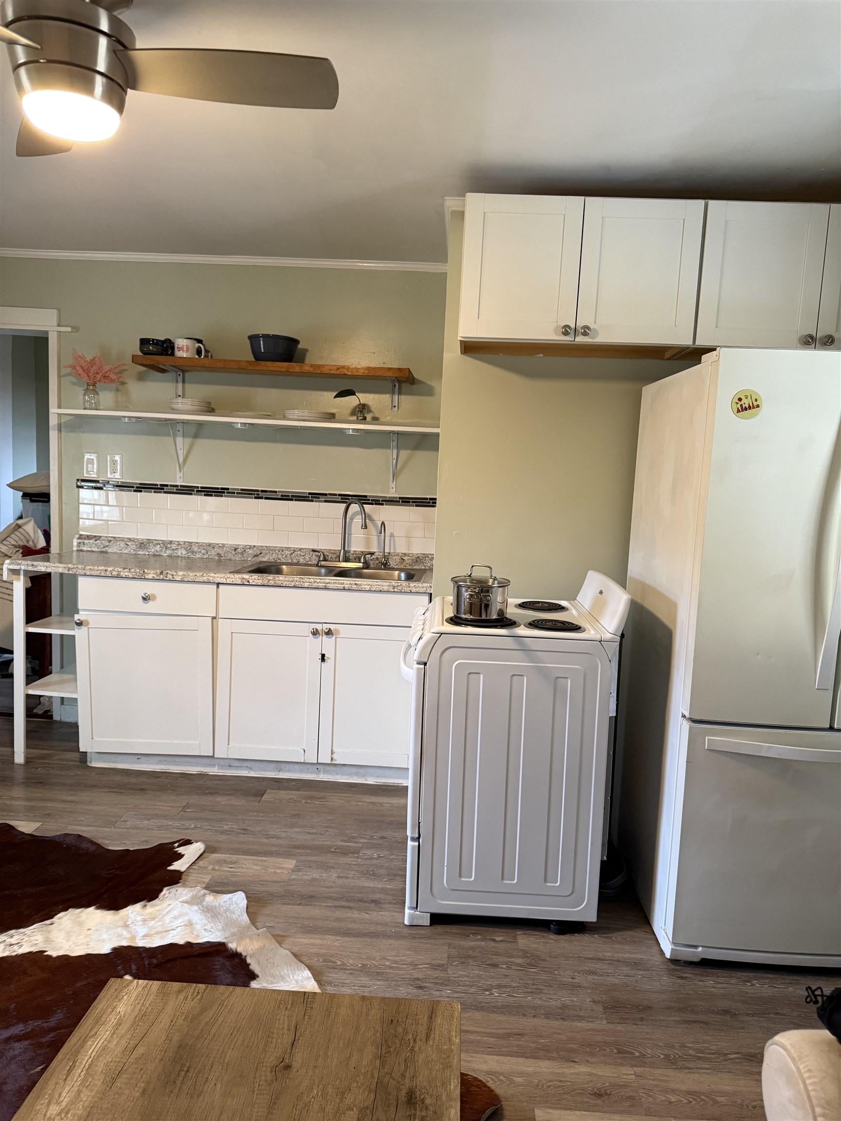 635-633 Stuart Street Staunton, VA 24401 - Photo 21 of 41 a kitchen with a refrigerator a stove and wooden cabinets