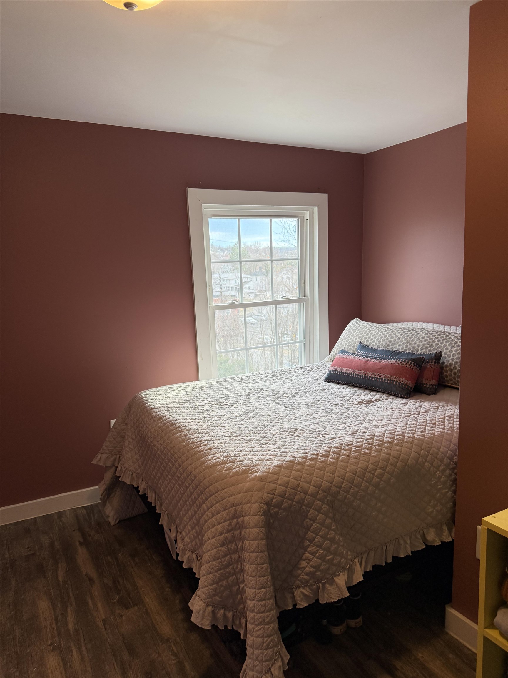 635-633 Stuart Street Staunton, VA 24401 - Photo 32 of 41 a bedroom with a bed and wooden floor