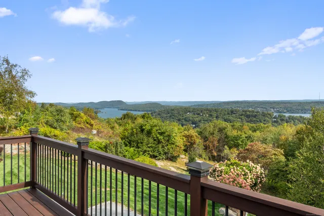 a view of city and mountain from a balcony