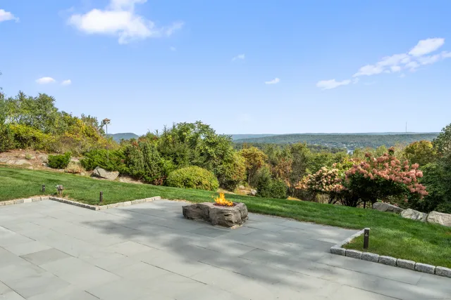 a big yard with road and trees