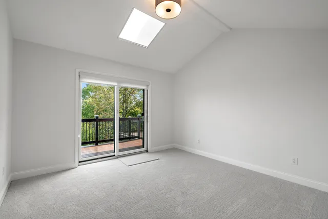 a bathroom with a shower sink and mirror
