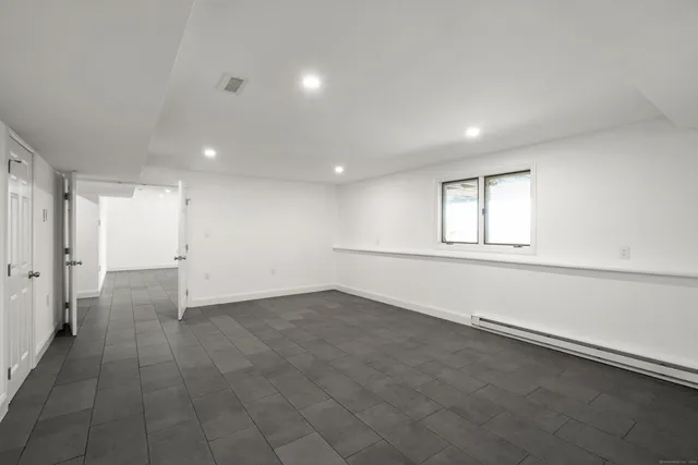 a view of a room with gym equipment and windows