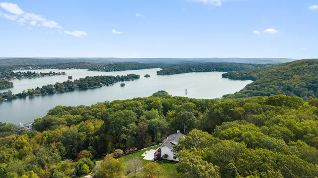 a view of a lake with houses in the back