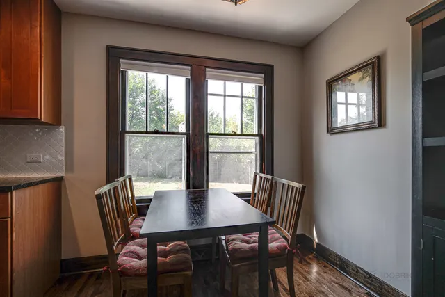a view of a dining room with furniture window and outside view