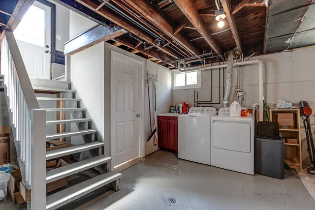 a view of storage and utility room with stairs