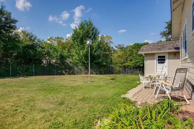 a view of a backyard with a patio