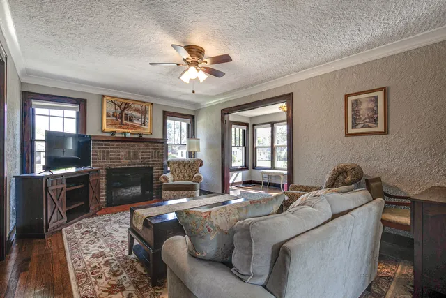 a living room with furniture and a fireplace