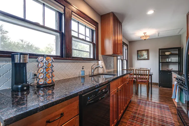 a kitchen with lots of counter top space and wooden floor