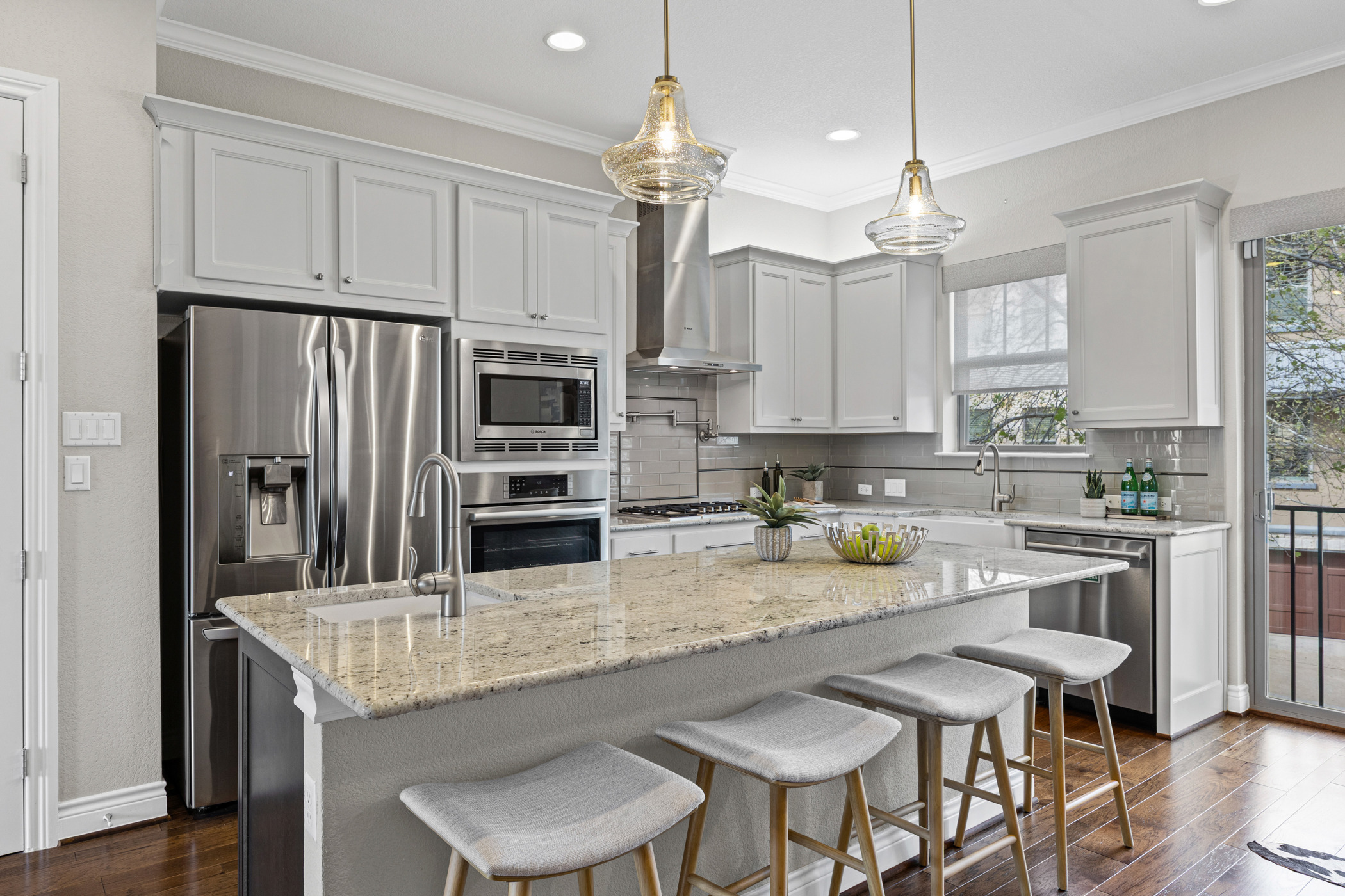 1112 Highknoll Lane Georgetown, TX 78628 - Photo 4 of 40 Large center island with prep sink—perfect for entertaining or casual meals