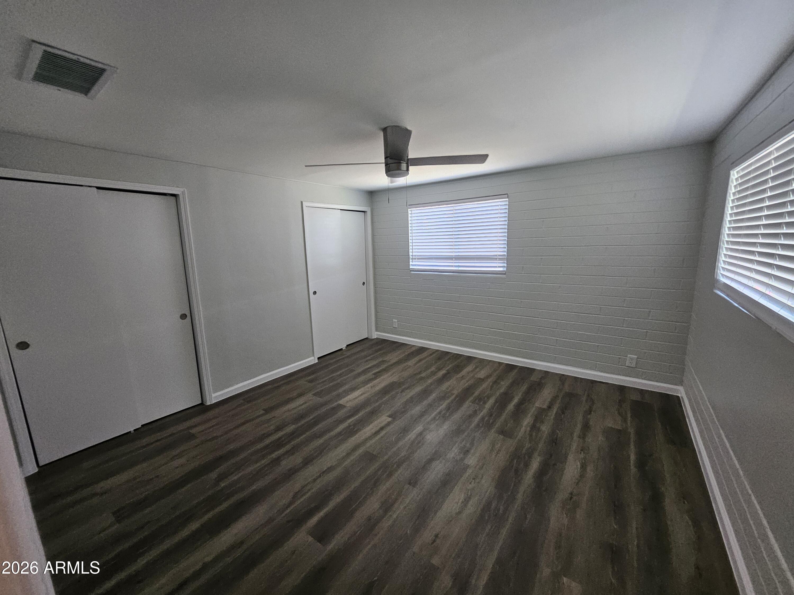 524 West 3rd Place Mesa, AZ 85201 - Photo 10 of 23 a view of empty room with wooden floor