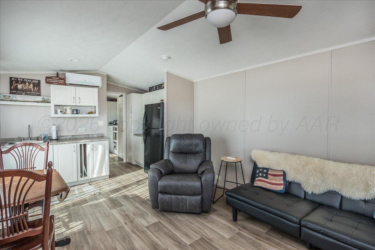 39600 Farm To Market 1705 Happy, TX 79042 - Photo 3 of 10 a living room with furniture and a wooden floor