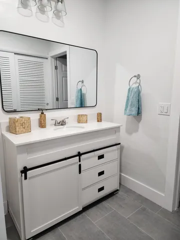 a kitchen with a sink cabinets and window