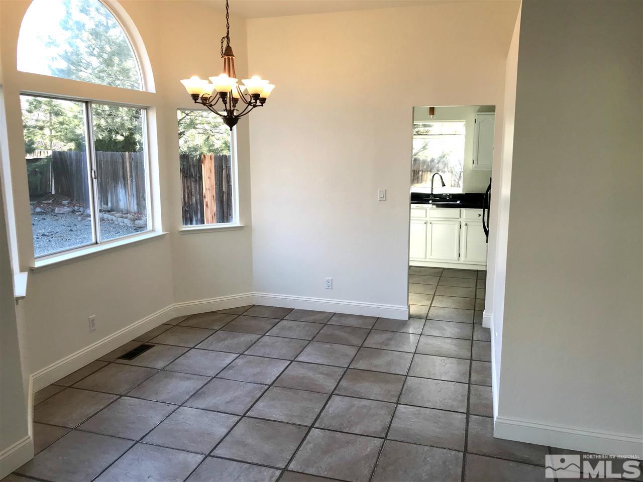 6325 Walnut Creek Road Reno, NV 89523 - Photo 3 of 10 a view of an empty room with a window